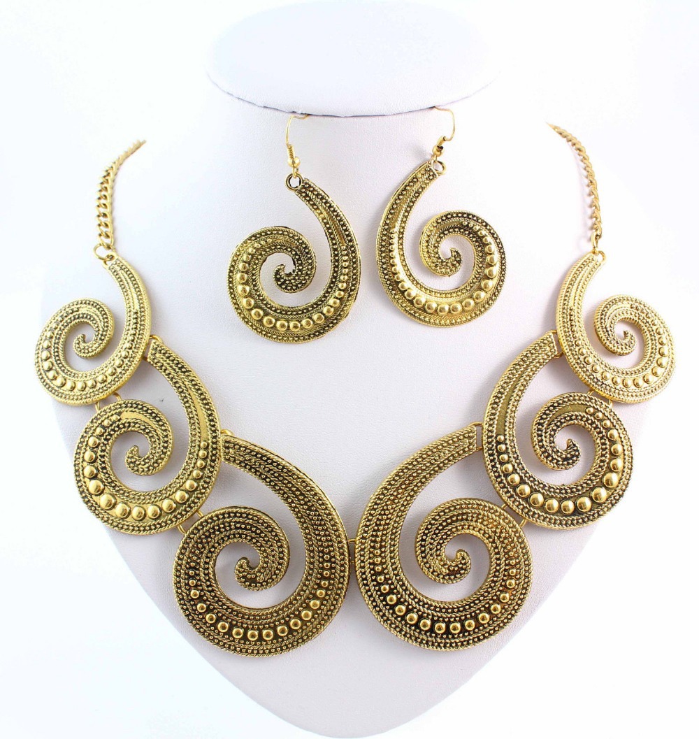gold/brass tone statement necklace with chunky earrings
