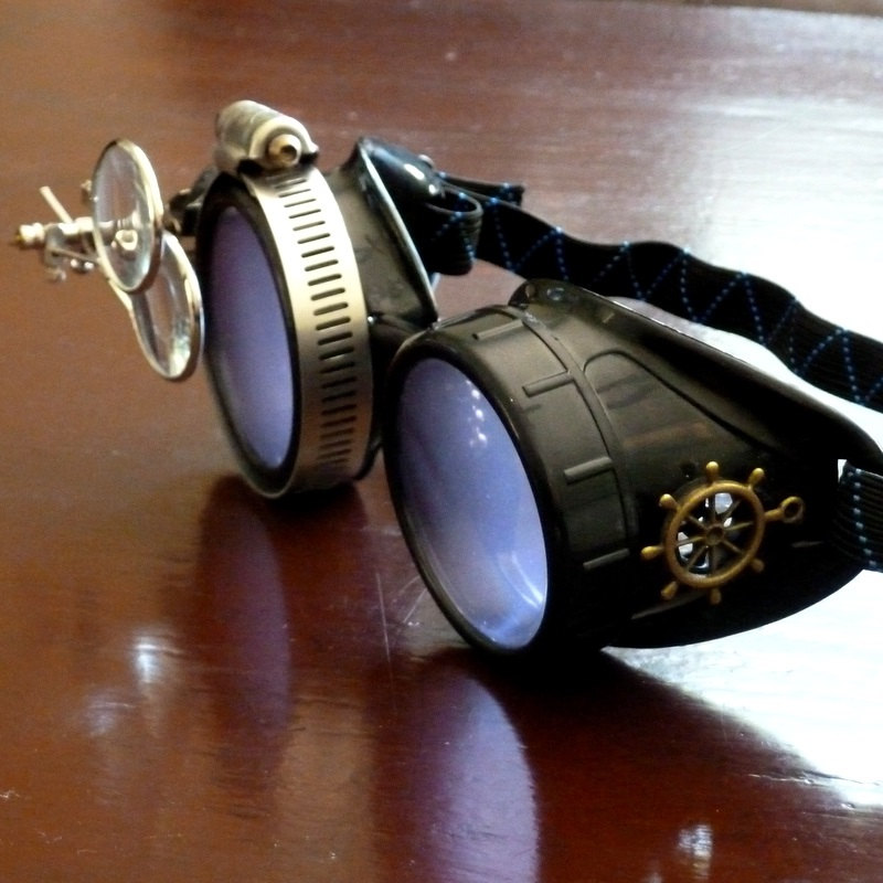 Black Goggles: Purple Lenses w/ Brass Ship’s Wheel & Eye Loupe