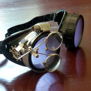 Black Goggles: Light Purple Lenses w/ Brass Ship's Wheel & Eye Loupe
