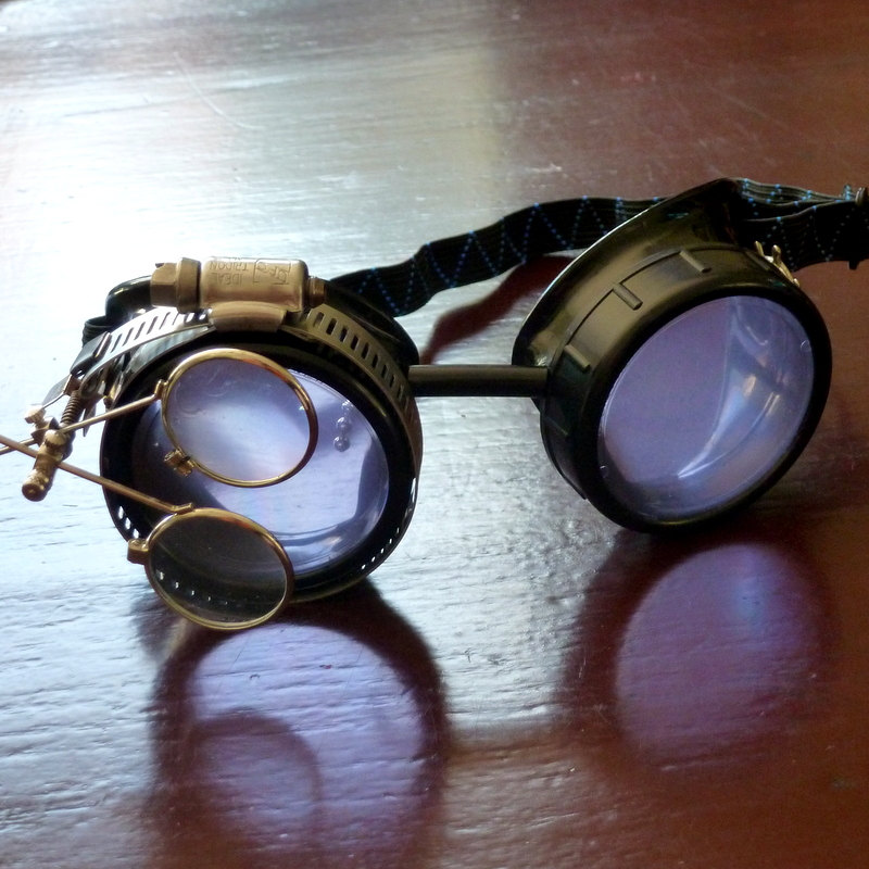 Black Goggles: Light Purple Lenses w/ Brass Ship's Wheel & Eye Loupe