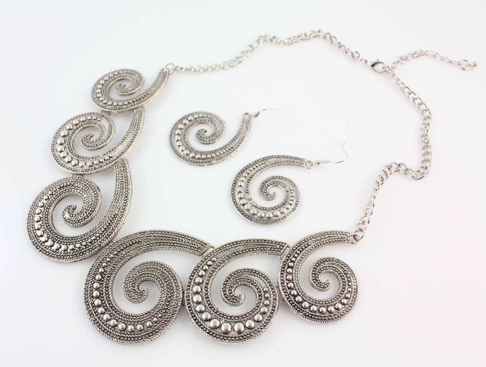 Silver tone statement necklace with chunky earrings